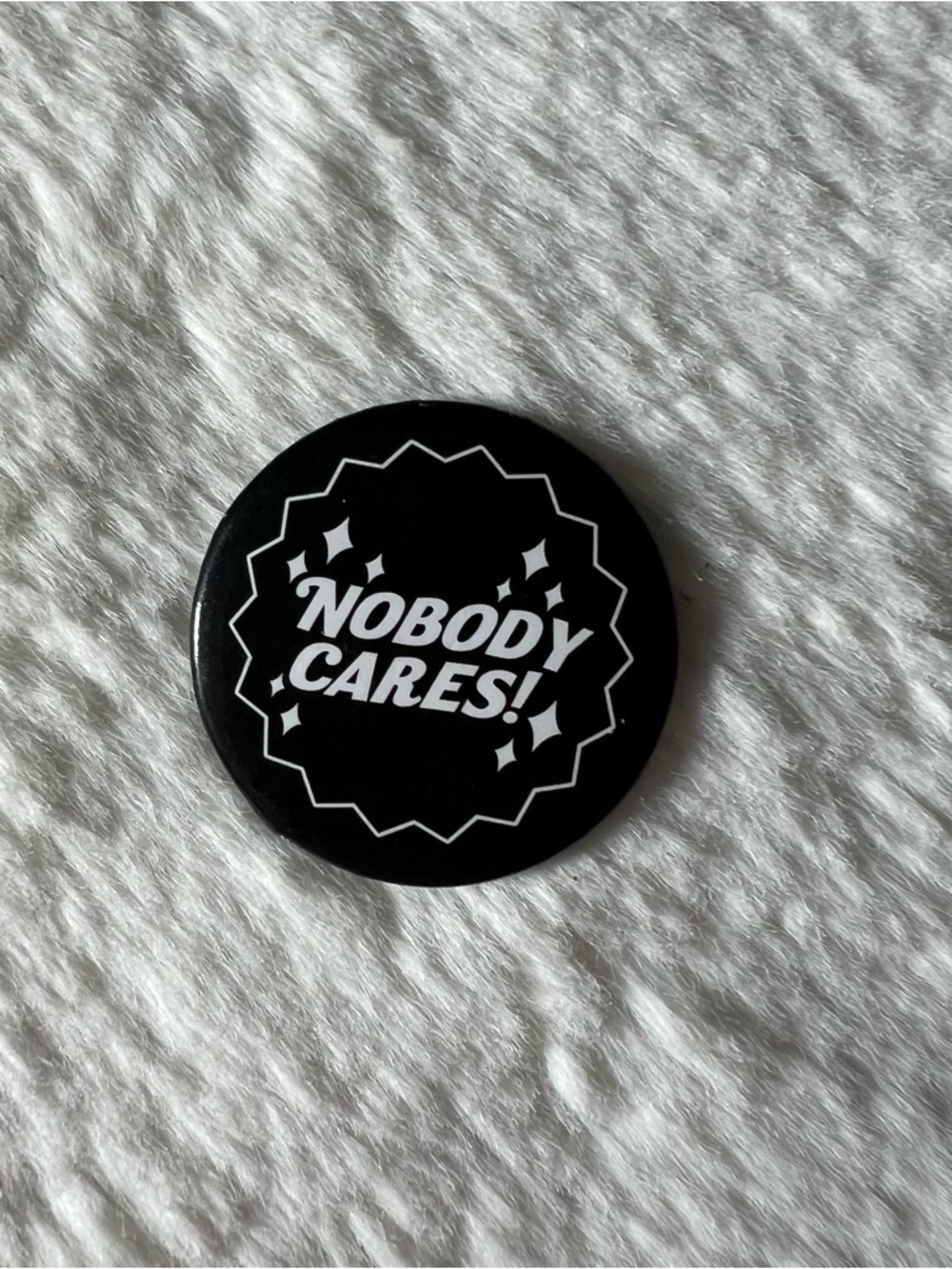 “Nobody Cares” Black Button Pin with Stars